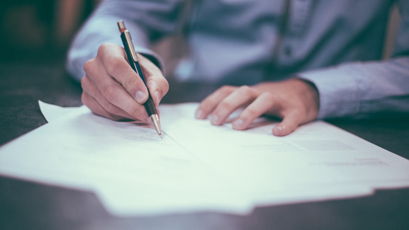 Professional reviewing legal documents and paperwork